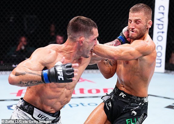 MANCHESTER, ENGLAND - JULY 27: (L-R) Preston Parsons hits Oban Elliott of England in a welterweight bout during the UFC 304 event at Co-op Live on July 27, 2024 in Manchester, England.  (Photo by Chris Unger/Zuffa LLC via Getty Images)