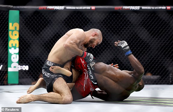 Mixed Martial Arts - UFC 304 - Manchester - Co-op Live, Manchester, Britain - July 28, 2024. Muhammad Mokaev fights Manel Kape during UFC 304. REUTERS/John Sibley