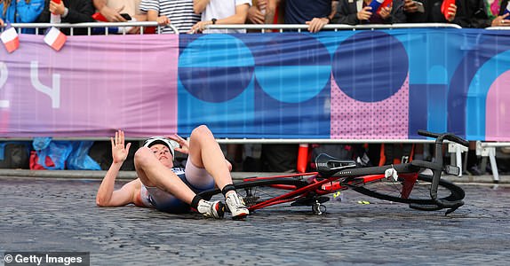 Lotte Miller of Team Norway seen post-fall during Women's Individual Triathlon.