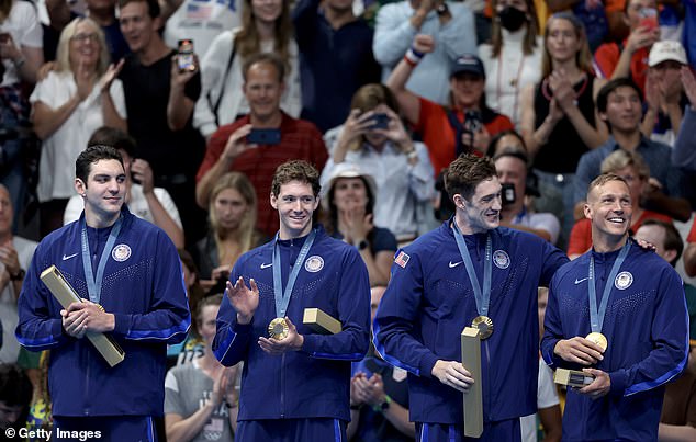 Jack Alexy, Chris Guiliano, Hunter Armstrong and Caeleb Dressel celebrate their success