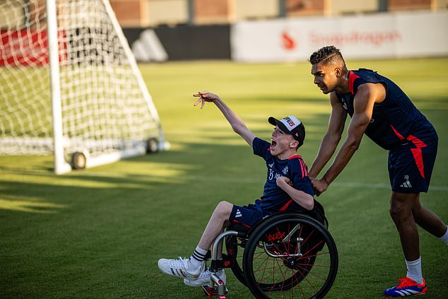 United players brought disabled supporter Alex Nield onto the pitch for photos after Casemiro spotted him in the stands at an open training session on Friday