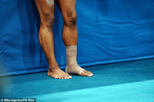 The four-time Olympic champion was also seen with tape strapped around her left ankle