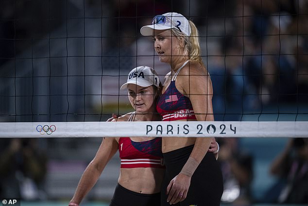 Kloth, right, and Nuss, left, celebrate victory in the women's pool B beach volleyball match