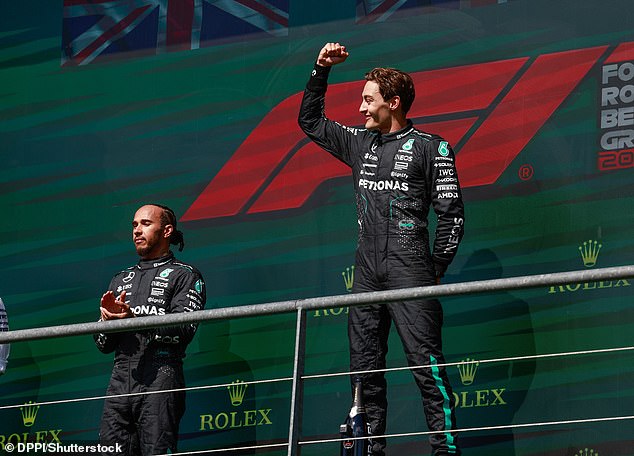 George Russell (right) celebrated winning the Belgian Grand Prix but was later disqualified