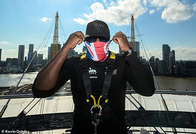 Chisora hides his face behind a Union Jack mask atop the O2, where he faced Joyce