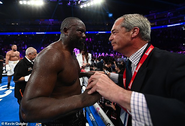 Derek Chisora receiving congratulations from Reform UK leader and MP Nigel Farage after the fight at the O2