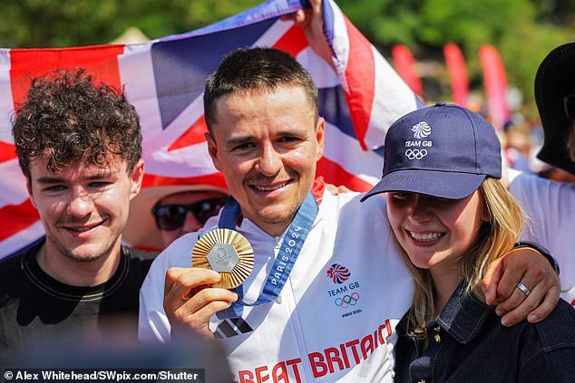 His girlfriend was in attendance to cheer on the Englishman as he crossed the finish-line