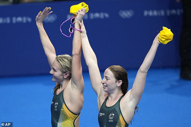 The two fastest women in the world are pictured saluting the crowd after the race