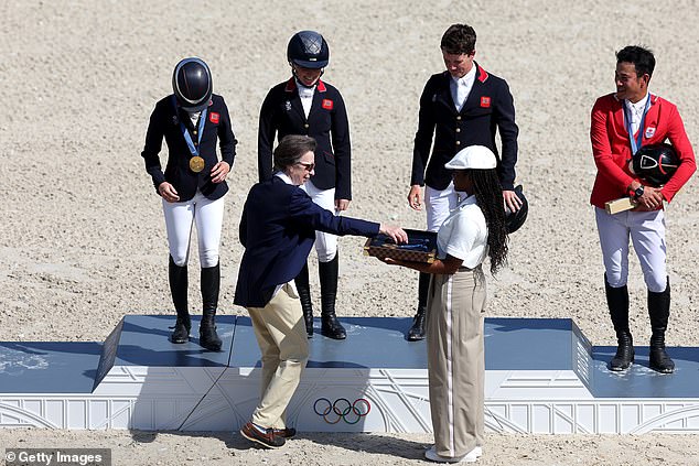 Princess Anne, who participated in eventing at the 1976 Montreal Games, presented medals to the equestrian team at Chateau de Versailles