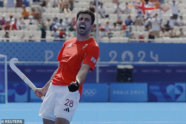 Lee Morton celebrates rescuing a point for GB after they were two goals down to the Netherlands