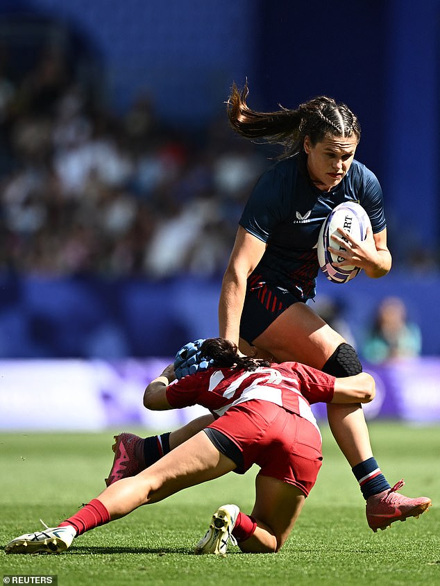 Ilona Maher of the United States runs over a Team Japan player during her team's win