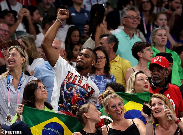 Simone Biles' husband Jonathan Owens is seen celebrating in Paris on Tuesday