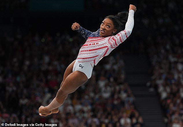 No Twisties this time: Simone Biles is seen spinning through the air on Tuesday in Paris