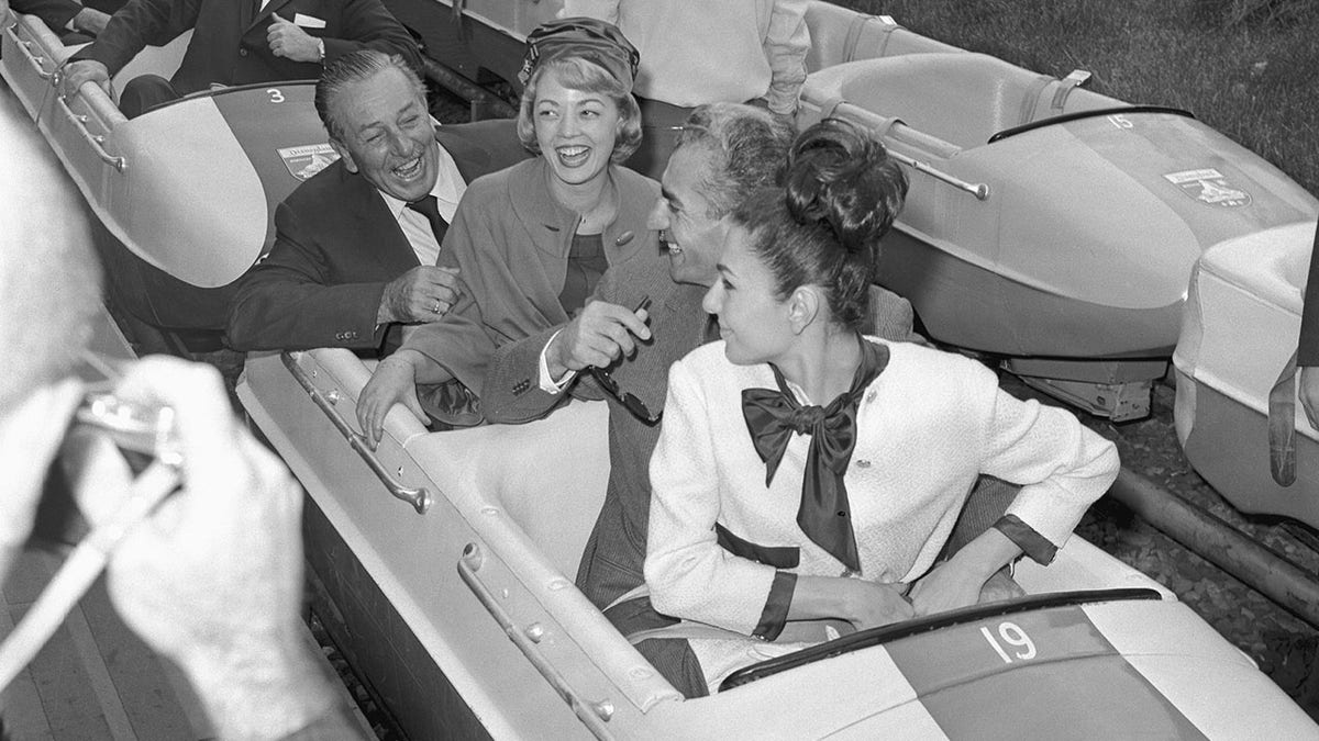 Walt Disney with the Shah of Iran and his wife on the Matterhorn.