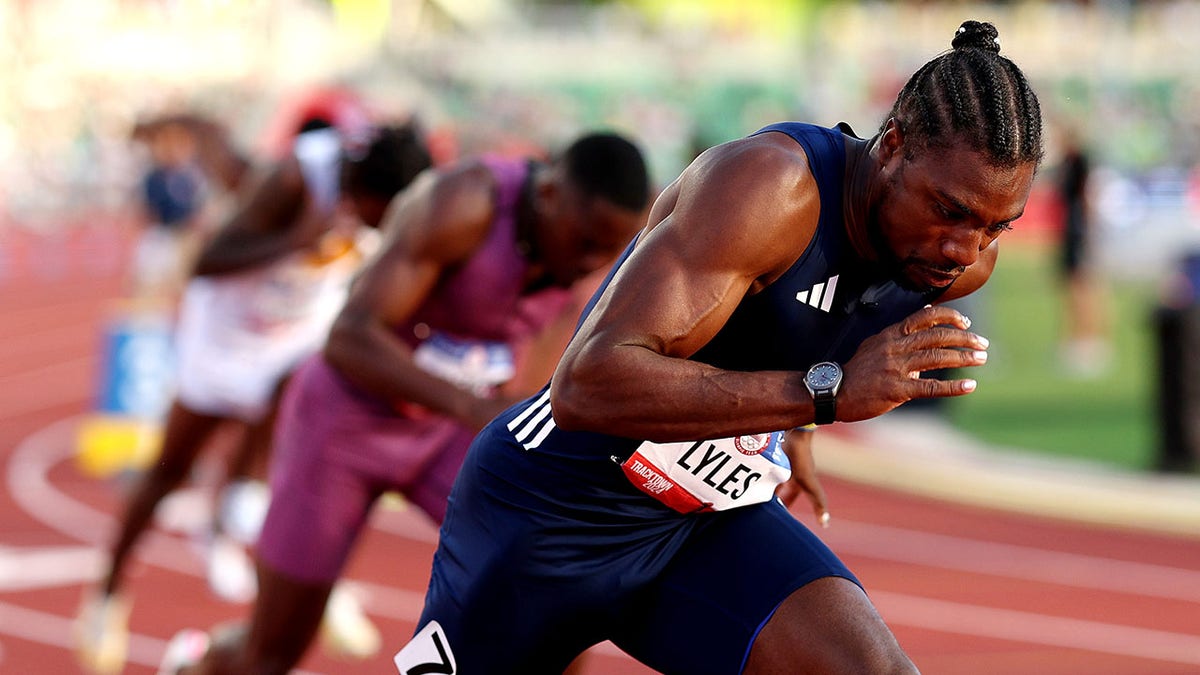 Noah Lyles competes in race