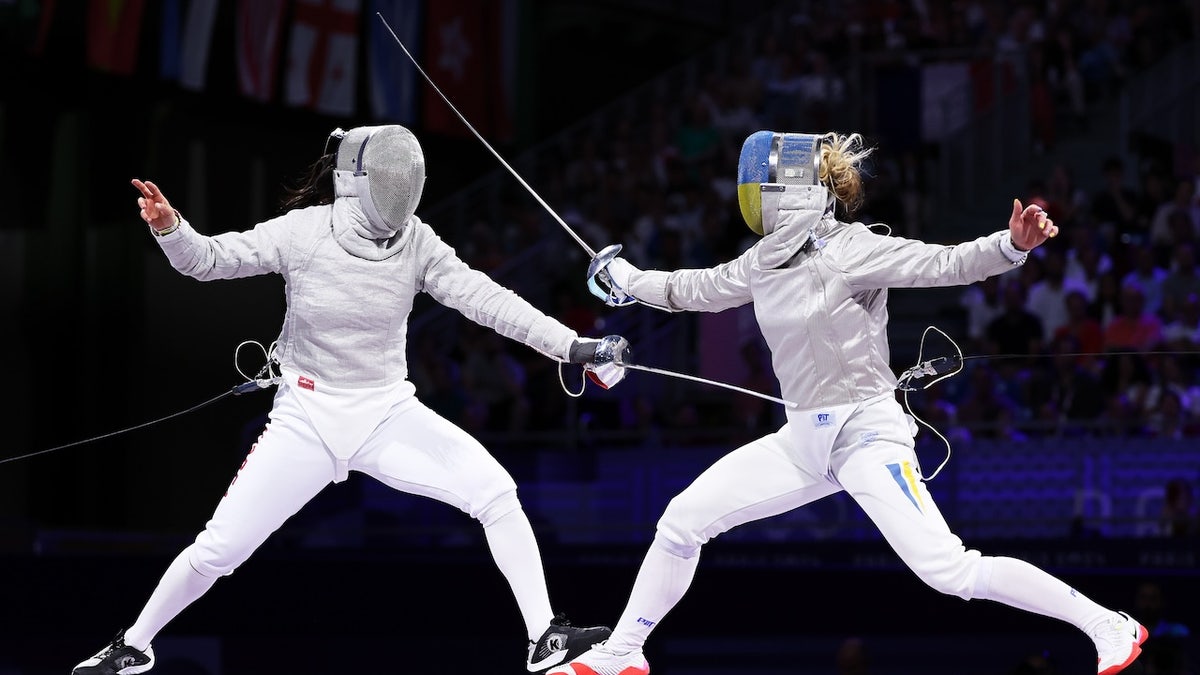 Sebin Choi and Olga Kharlan compete.