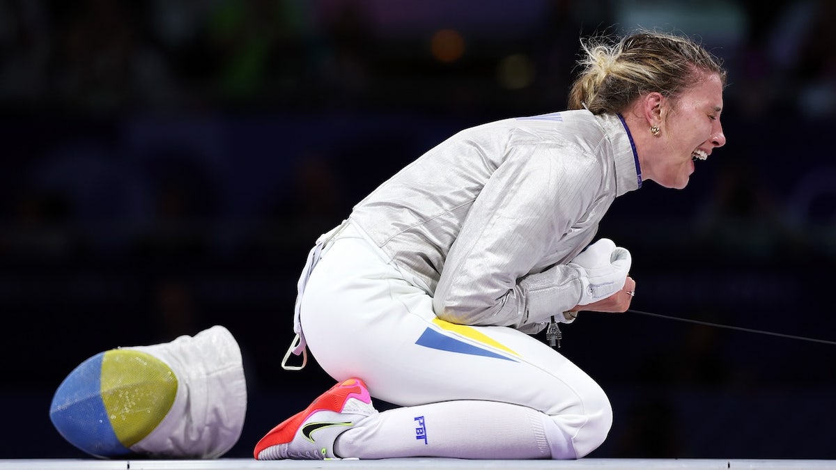 Olga Kharlan celebrates winning the Fencing Women's Sabre Individual Bronze Medal