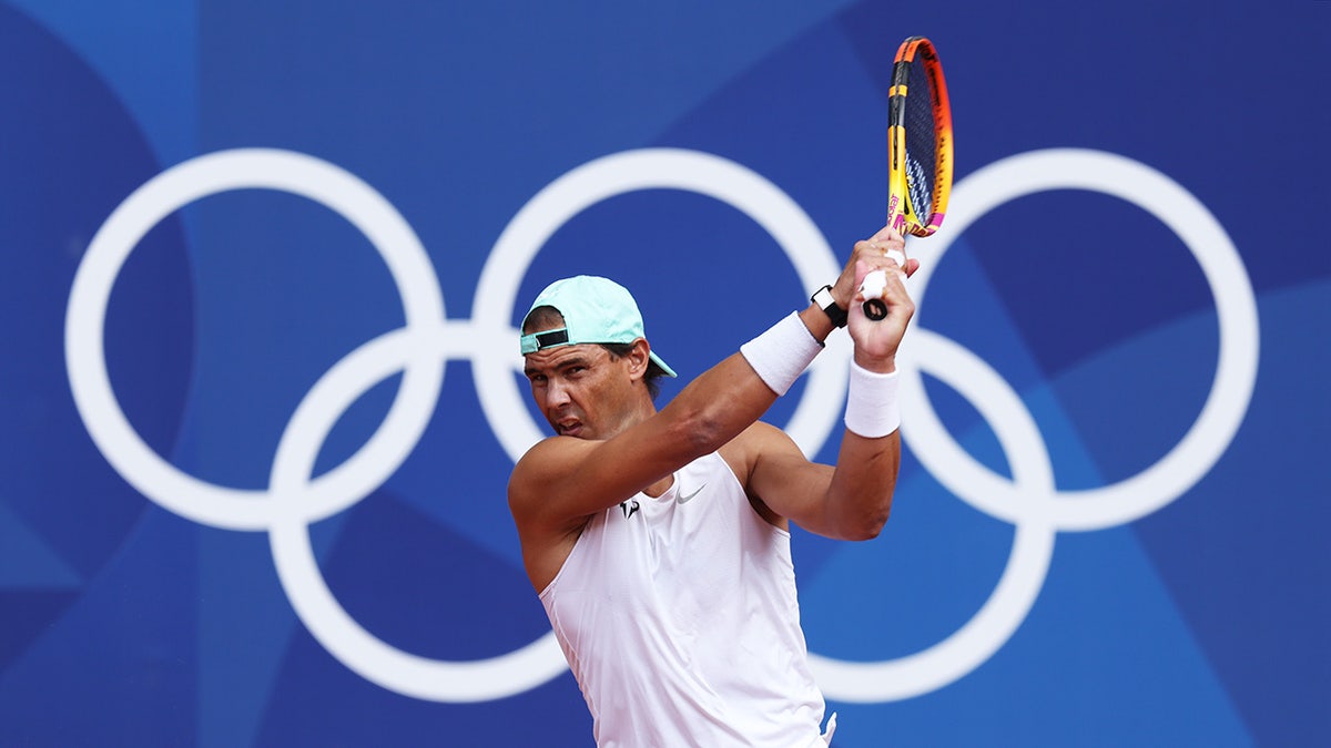 Rafael Nadal plays a backhand