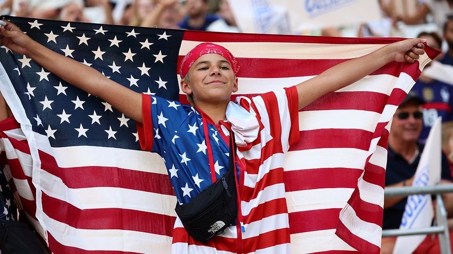 Young USA fan with flag