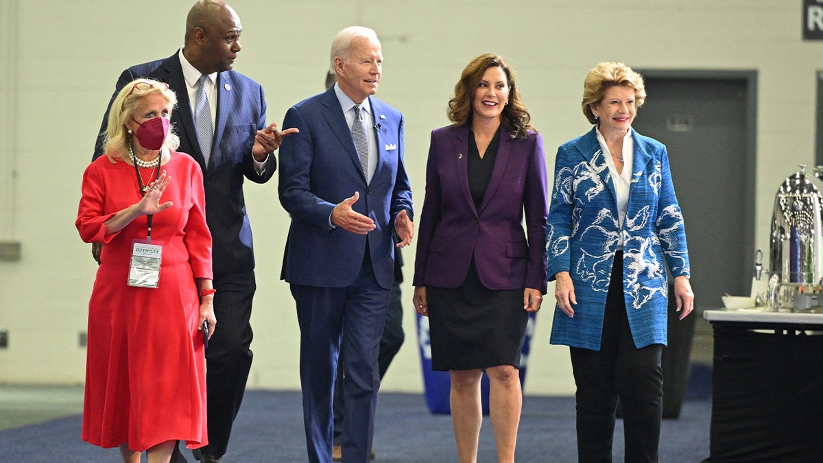 President Joe Biden, Michigan Governor Gretchen Whitmer, and U.S. Senator Debbie Stabenow tour the 2022 North American International Auto Show in Detroit, Michigan, on September 14, 2022.