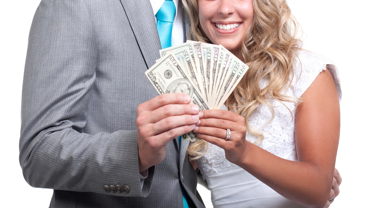 A married couple with cash.