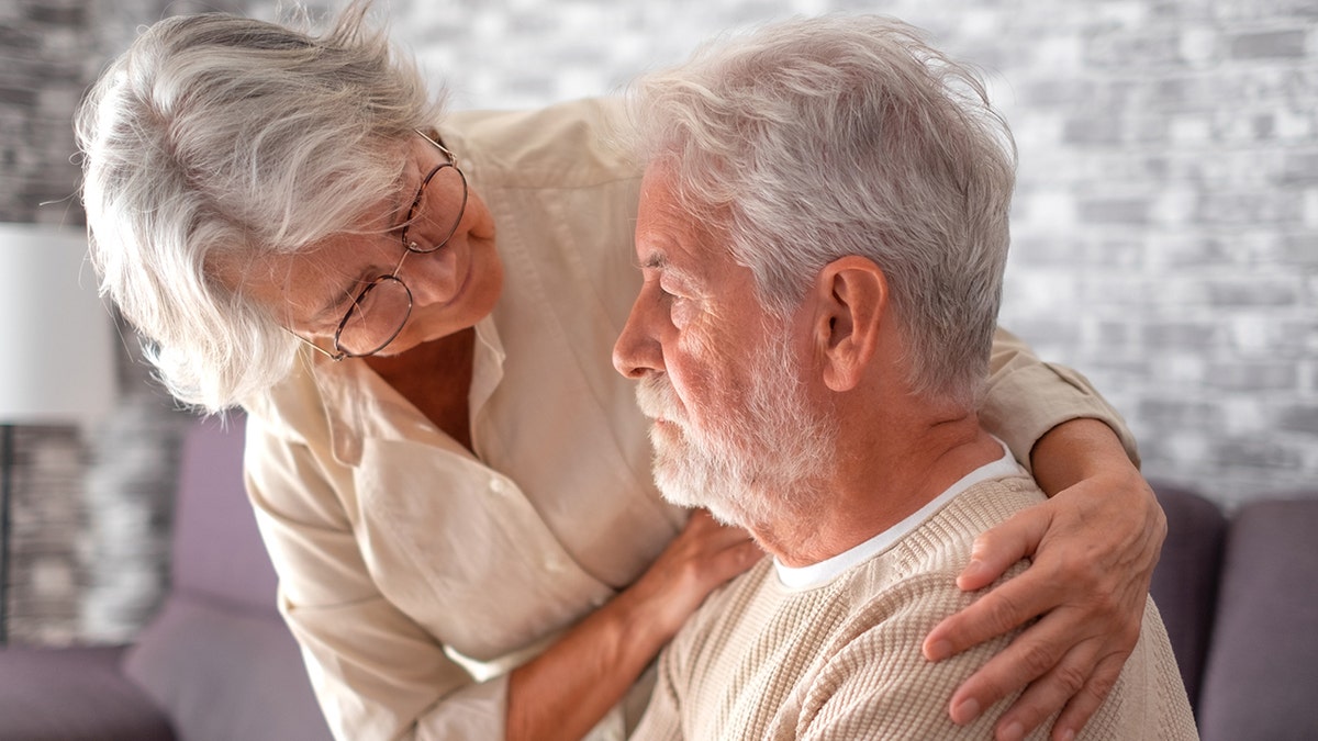 senior couple comfort each other