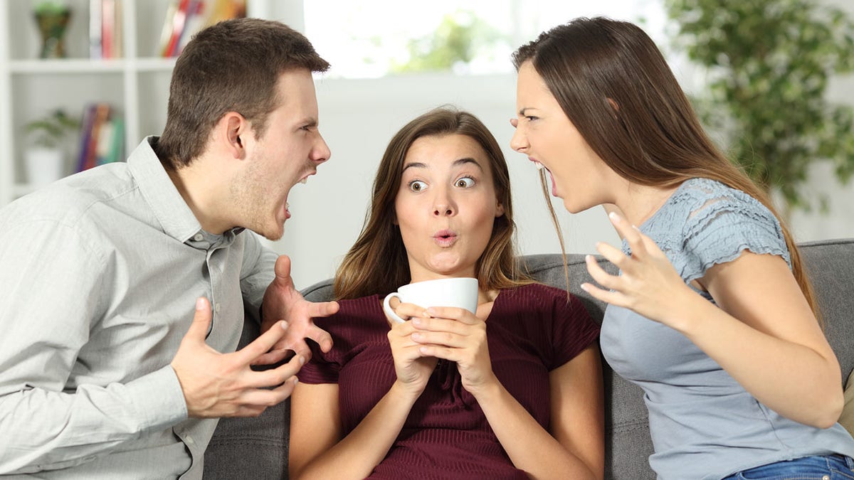 Three individuals arguing.