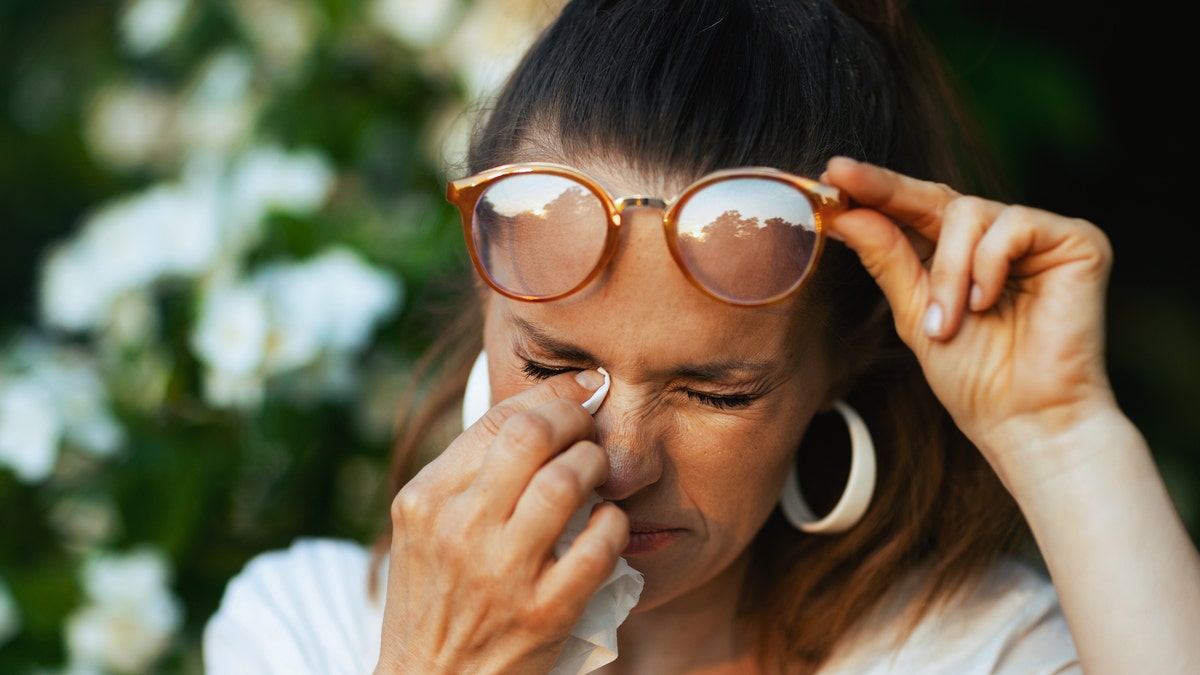 Woman experiencing itchy eyes due to allergies