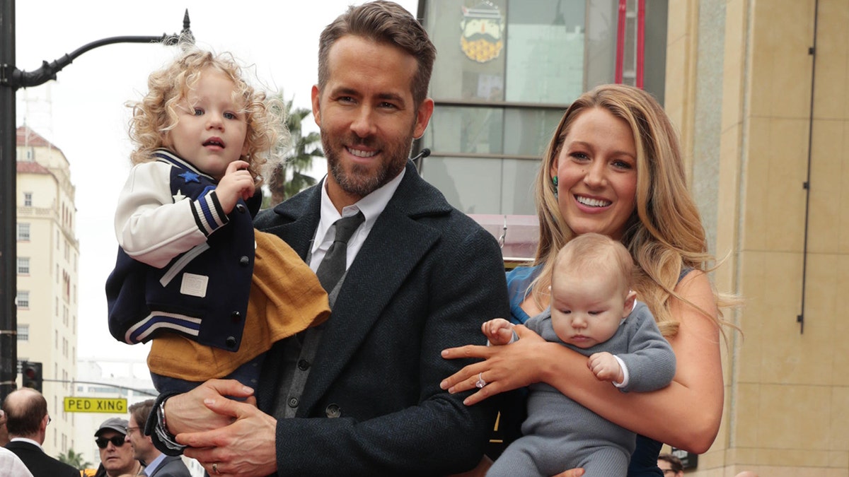 Blake Lively and Ryan Reynolds with their kids on the Hollywood Walk of Fame.