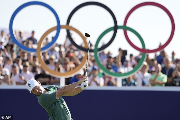 Rory McIlroy, of Ireland, plays his shot off the 1st tee during the first round of the men's golf event at the 2024 Summer Olympics, Thursday, Aug. 1, 2024, at Le Golf National in Saint-Quentin-en-Yvelines, France. (AP Photo/George Walker IV)