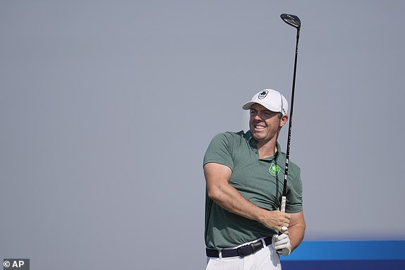 Rory McIlroy, of Ireland, reacts after playing his tee shot on the 3rd during the first round of the men's golf event at the 2024 Summer Olympics, Thursday, Aug. 1, 2024, at Le Golf National in Saint-Quentin-en-Yvelines, France. (AP Photo/George Walker IV)