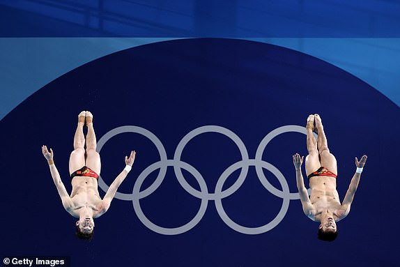 PARIS, FRANCE - AUGUST 02: Long Daoyi and Wang Zongyuan of Team China compete in the Men's Synchronised 3m Springboard Final on day seven of the Olympic Games Paris 2024 at Aquatics Centre on August 02, 2024 in Paris, France. (Photo by Quinn Rooney/Getty Images)