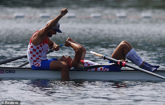 Paris 2024 Olympics - Rowing - Men's Pair Final A - Vaires-sur-Marne Nautical Stadium - Flatwater, Vaires-sur-Marne, France - August 02, 2024. Martin Sinkovic of Croatia and Valent Sinkovic of Croatia react after winning gold. REUTERS/Molly Darlington