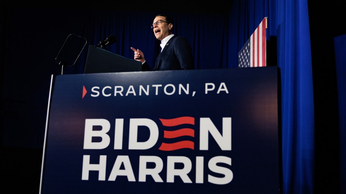 Gov. Josh Shapiro speaks during a campaign event with US President Joe Biden