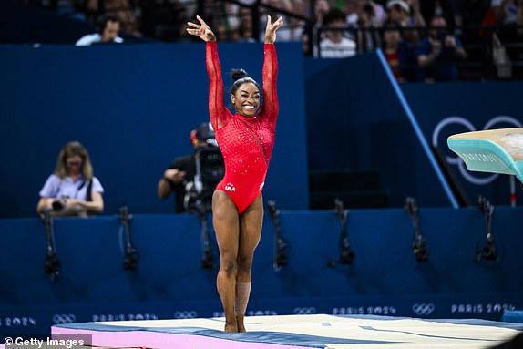 PARIS, FRANCE - AUGUST 3: Simone Biles of Team United States celebrates after completing her routine during the Artistic Gymnastics Women's Vault Final on day eight of the Olympic Games Paris 2024 at the Bercy Arena on August 3, 2024 in Paris, France. (Photo by Tom Weller/VOIGT/GettyImages)