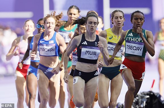 epa11529380 Laura Muir of Britain competes in a Women 1500m heat of the Athletics competitions in the Paris 2024 Olympic Games, at the Stade de France stadium in Saint Denis, France, 06 August 2024.  EPA/RONALD WITTEK