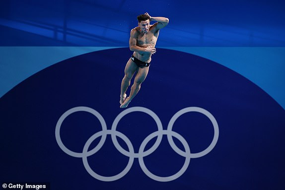 PARIS, FRANCE - AUGUST 06: Jordan Christopher Houlden of Team Great Britain competes in the Men's 3m Springboard Preliminary on day eleven of the Olympic Games Paris 2024 at Aquatics Centre on August 06, 2024 in Paris, France. (Photo by Clive Rose/Getty Images)