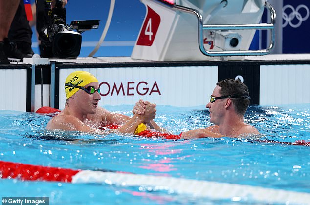 Proud (right) congratulating Olympic champion Cameron McEvoy (left) following the final