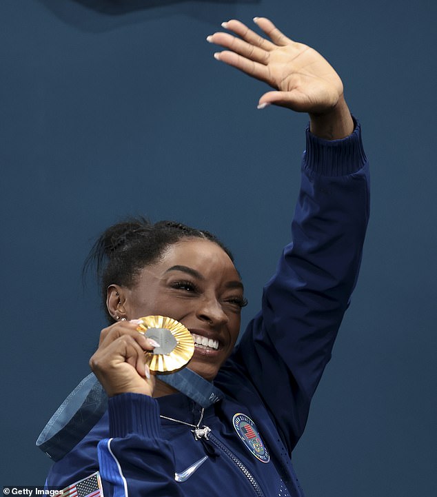 Biles waves to the crowd after winning her second gold medal of the Paris Games on Thursday