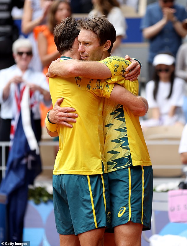 Team Australia celebrating match point during the Men's Doubles Gold Medal match against the USA