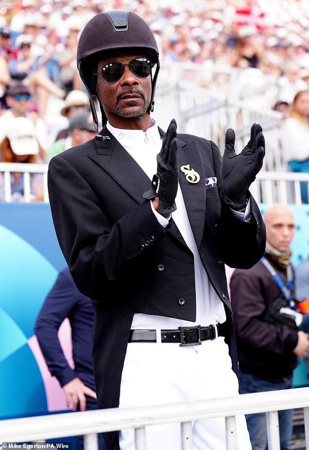 Snoop Dogg was dressed in breeches, a dressage tailcoat and hard hat, Saturday, in Versailles