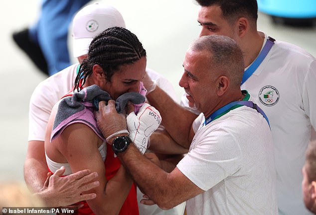 Khelif was congratulated by her team after leaving the ring in floods of tears