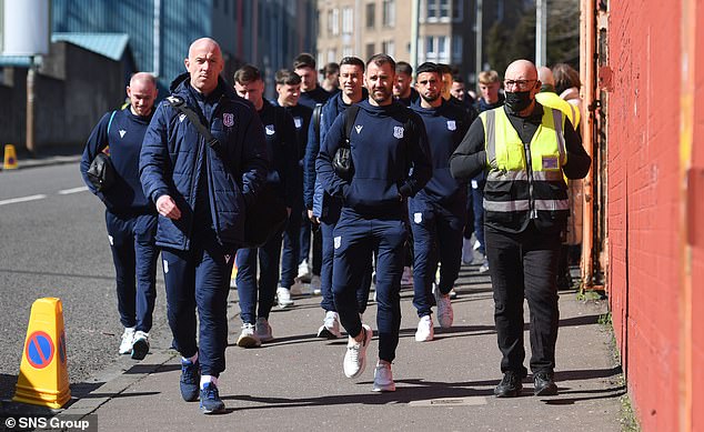 Dundee players walk to Tannadice before the last derby in 2022