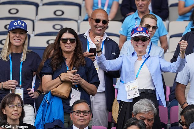 Standing right next to Rapinoe were former USWNT striker Mia Hamm and midfielder Julie Ertz