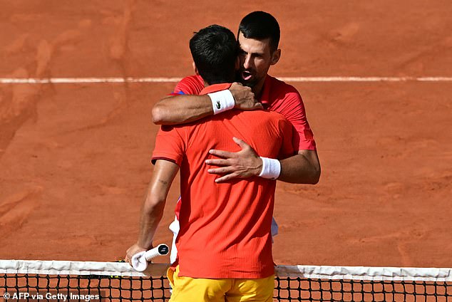 New Olympic champion Djokovic pictured hugging Carlos Alcaraz after beating him 7-6 7-6