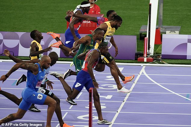 The 27-year-old finished just 0.005 seconds ahead of Jamaica's Kishane Thompson (yellow jersey)