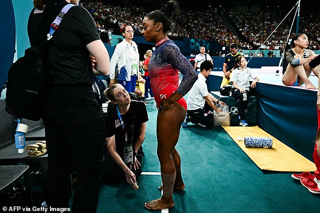 Biles then went to get medical attention and came back wearing a strapping on her left leg