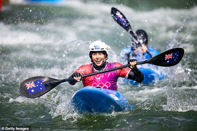 Noemie Fox celebrates as she crosses the finish line to become the third Olympic medallist in her family after her mother and sister