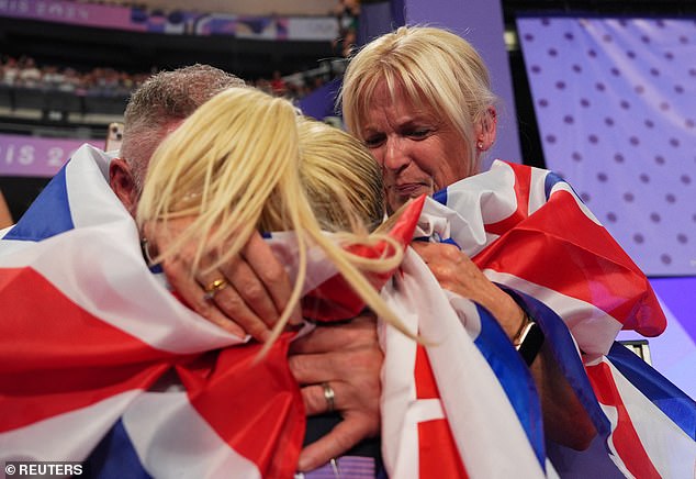 Keely Hodgkinson of Britain celebrates winning gold with friends and family