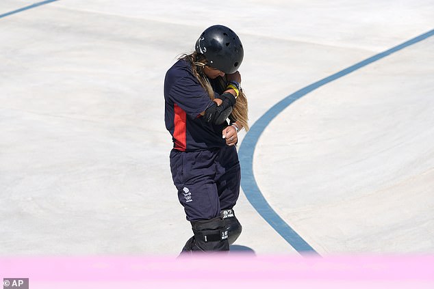 She clutched onto her wrist, then her shoulder - the same one she dislocated before the Olympics